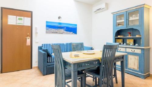 a dining room with a table and chairs at Renda Apartments in Trapani