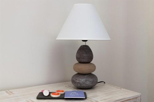a lamp sitting on top of a table at Bed & go Trento in Trento