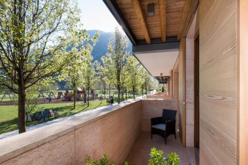 a balcony with a view of a park at Bed & go Trento in Trento