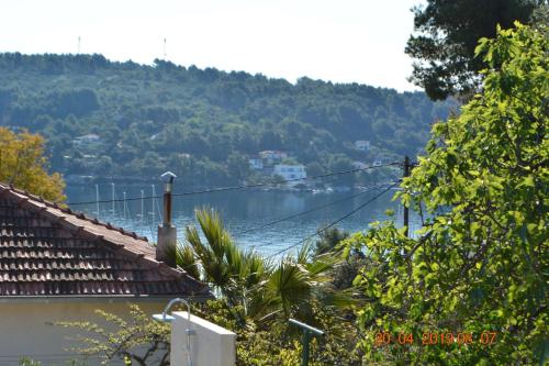 a view of a body of water from a house at Dreamlodge - Luxe Dalmatian Villa, private pool, parking, mooring, breathtaking sea & mountain view, at 150 m from idyllic private beach in Rogač