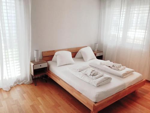 Postel nebo postele na pokoji v ubytování Easy-Living Apartments Dietwil