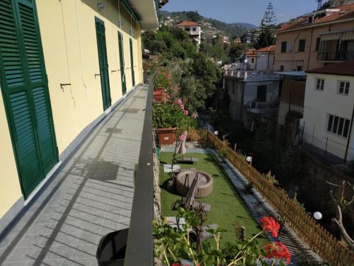 a balcony with a garden on the side of a building at Casa delle Ginestre Bike in Sanremo