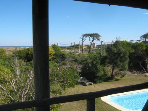 a view from the balcony of a house with a swimming pool at Hotel El Refugio nudista naturista opcional in Chihuahua