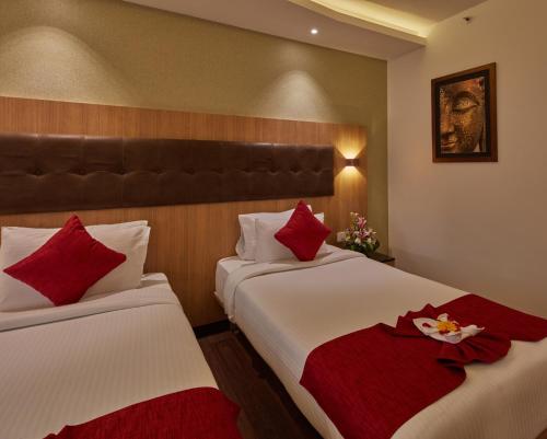 Cama o camas de una habitación en Shivas Galaxy Hotel