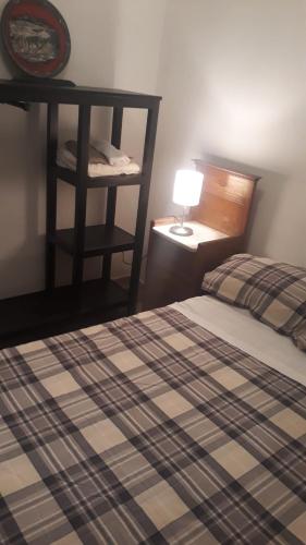 Ein Bett oder Betten in einem Zimmer der Unterkunft Carrubo - Giardino in città