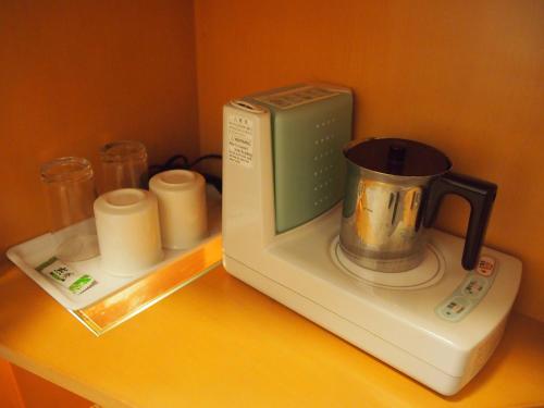a toaster oven sitting on top of a counter at Nest Hotel Kumamoto in Kumamoto
