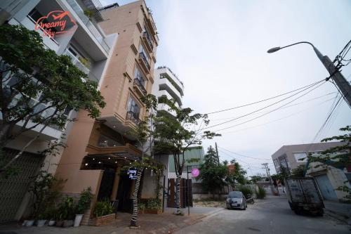a car is parked in front of a building at Dreamy Sky - Airport View Boutique Hotel in Da Nang