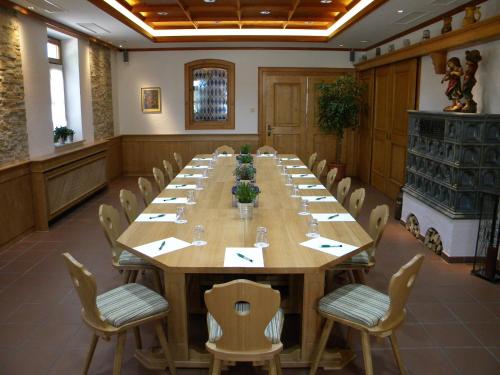 a large conference room with a long table and chairs at Landgasthof Nagerl in Marzling