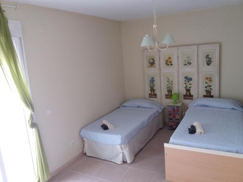 En eller flere senge i et værelse på Benicasim Primera Linea