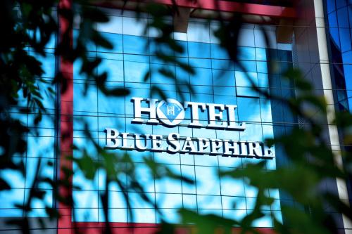 a sign on the facade of a hotel at Hotel Blue Sapphire in Dar es Salaam