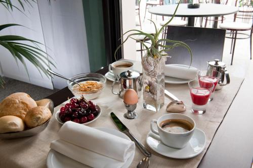 a table with breakfast foods and drinks on it at Hotel Felix in Rimini