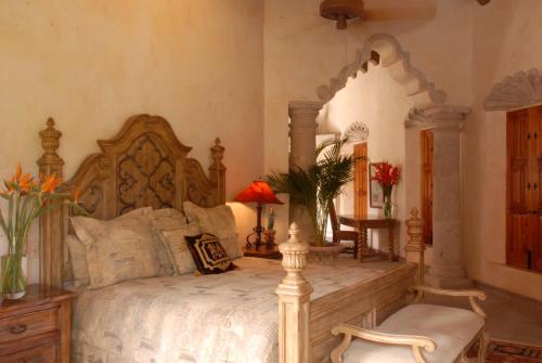 Ein Bett oder Betten in einem Zimmer der Unterkunft Hacienda de los Santos