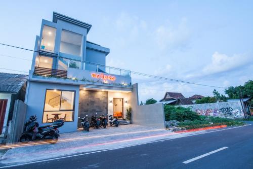 a group of motorcycles parked outside of a building at Eclipse Kerobokan in Kerobokan