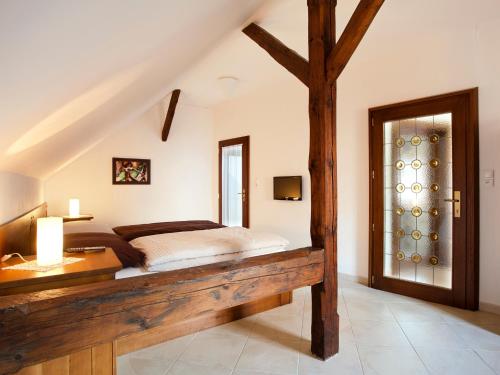 a bedroom with a large bed and a window at Staroměstský Penzion in Tábor