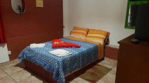 En eller flere senge i et værelse på Pousada Lindóia