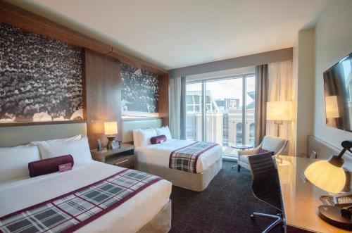 Säng eller sängar i ett rum på Texas A&M Hotel and Conference Center