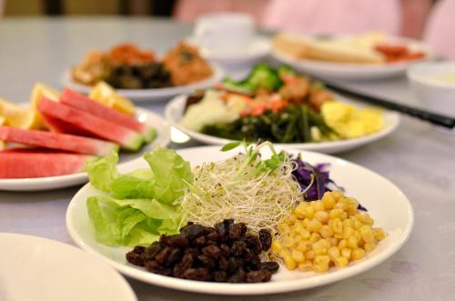 a group of plates of food on a table at Ever Delightful Business Hotel in Chiayi City