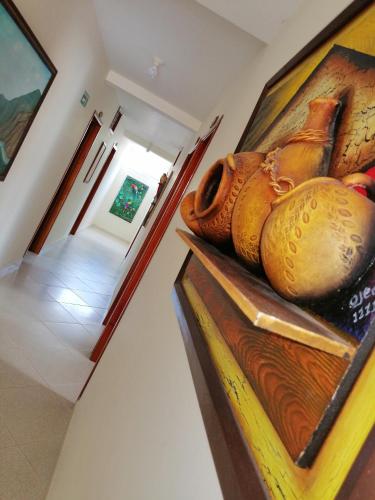 a room with a painting on the wall at Hotel el Paraíso del Valle in Valle de San José