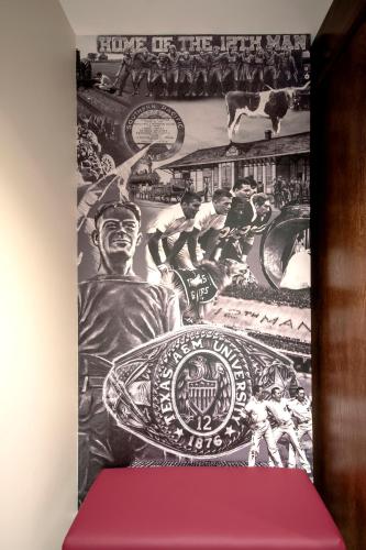 a mural on the wall of a room with a painting at Texas A&M Hotel and Conference Center in College Station