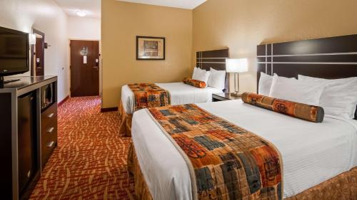 Кровать или кровати в номере SureStay Hotel by Best Western Robinsonville Tunica