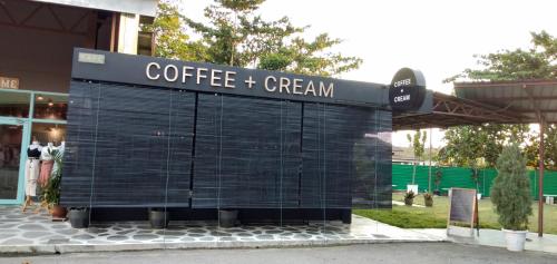 a building with a sign that reads coffee creamer at THE WOOD BOUTIQUE HOTEL in Muar