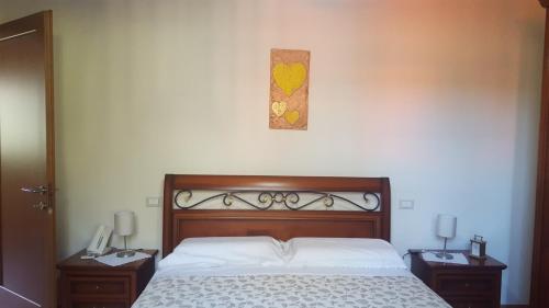 Ένα ή περισσότερα κρεβάτια σε δωμάτιο στο Casa Monaco