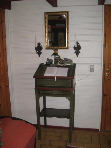 a desk in a room with a mirror on a wall at Naboløs Rooms, near Munkebo, Kerteminde and Nyborg in Bovense