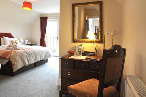 Ένα ή περισσότερα κρεβάτια σε δωμάτιο στο Dunallan Guest House