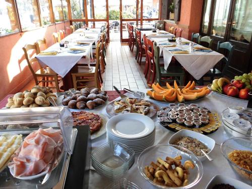 a long table with many different types of food at Alloggi Taverna Caorlina in Caorle