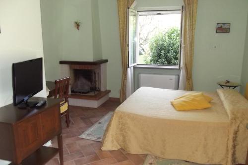Säng eller sängar i ett rum på Antica Locanda Della Via Francigena