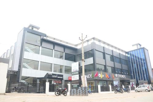 a large building with motorcycles parked in front of it at GenX Mirzapur in Mirzāpur