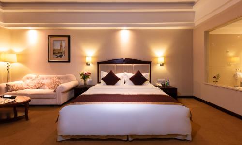 Ένα ή περισσότερα κρεβάτια σε δωμάτιο στο Country Garden Phoenix Hotels Shenyang Yuhong