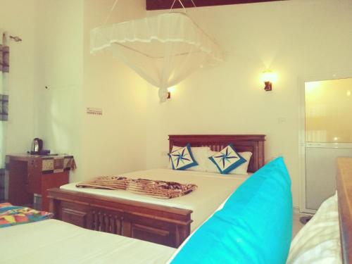 Letto o letti in una camera di Green Village