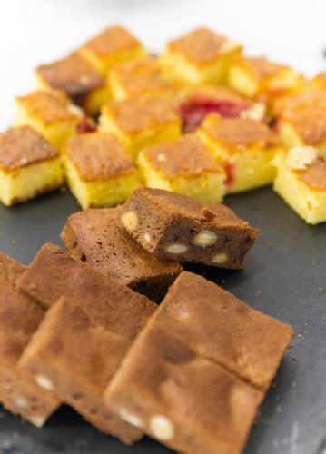 a pile of brownies sitting on top of a table at Oca Playa de Foz Hotel & Spa in Foz