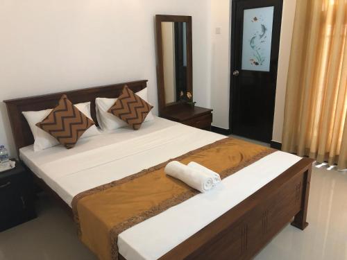 Ліжко або ліжка в номері Kandyan Lounge
