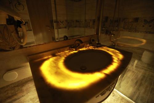 a bathroom with a sink and a mirror at Hotel Uzbekistan in Urganch