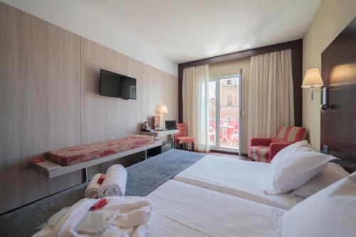 Postel nebo postele na pokoji v ubytování Hotel Salymar