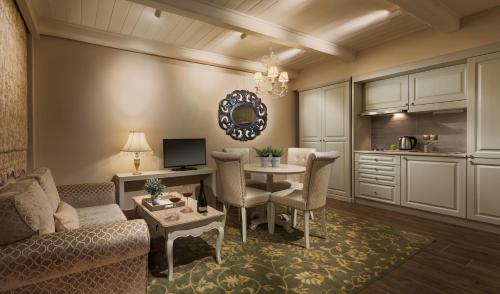 a living room with a couch and a table at Kyniska Palace Conference & Spa in Mystras