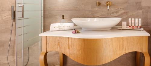 a bathroom with a counter with a sink on it at Kyniska Palace Conference & Spa in Mystras