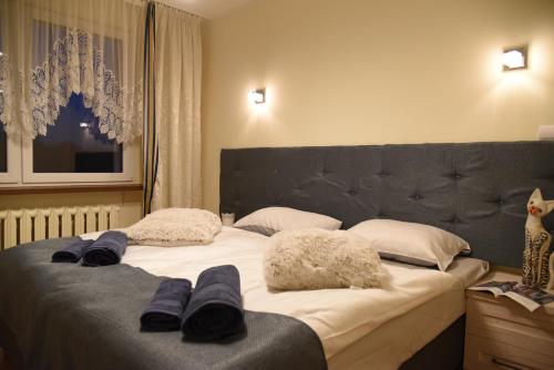 Posteľ alebo postele v izbe v ubytovaní Blue Apartments Kołobrzeg