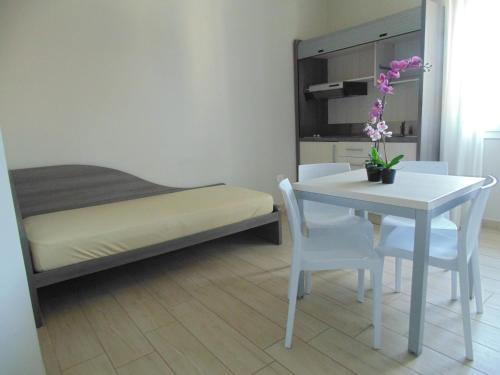 Ένα ή περισσότερα κρεβάτια σε δωμάτιο στο Residence Conchiglie