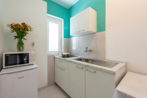 Η κουζίνα ή μικρή κουζίνα στο Apartment Fiorenini