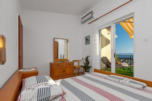 Postel nebo postele na pokoji v ubytování Apartment Gojak Mišo Alen
