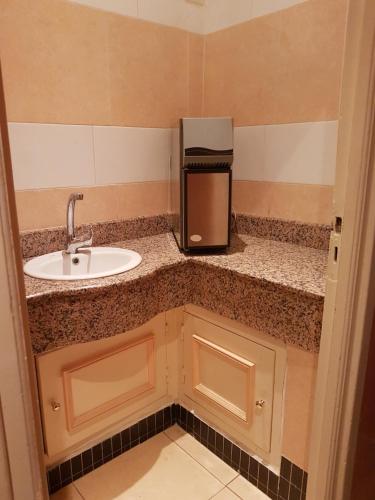 A bathroom at Ambassy Hotel