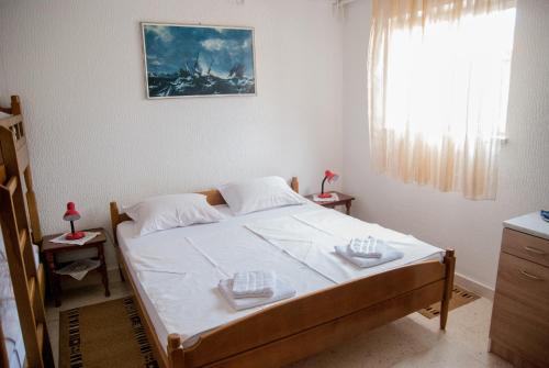 Un ou plusieurs lits dans un hébergement de l'établissement Slobo Apartment