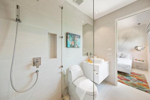 a bathroom with a shower and a toilet and a sink at BEACHSIDE VILLA plus APARTMENT - AVA - at SUNSET COVE LUXURY VILLAS, 5 BED 5 BATH, Amazing SEA and MOUNTAIN VIEWS, only 100m walk to Swimming Beach in Bang Rak Beach