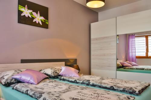Posteľ alebo postele v izbe v ubytovaní Apartment Klaudio