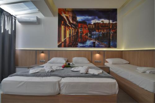 Postel nebo postele na pokoji v ubytování Dafni Plus Hotel