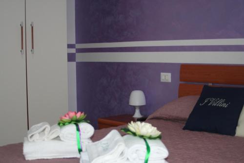 Ένα ή περισσότερα κρεβάτια σε δωμάτιο στο I Villini Affittacamere