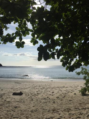 a view of a beach with the ocean in the background at Pura Vista Hotel in Ocotal